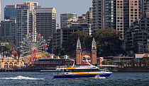 Ferries in the in the harbour in Sydney, with funfair in the background, New South Wales, Australia, October 2012.