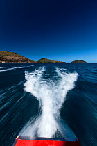Wake of boat on coast of Hamilton Island, part of the Whitsunday Island group, Australia, Queensland, November 2012.