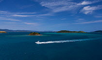 A luxury yacht cruising off of Hamilton Island, Whitsundays, Queensland, Australia. November 2012.