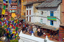 Shops and prayer flags around Bodnath,the largest stupa in Nepal, Durbar Square, Kathmandu, Nepal. November 2014.
