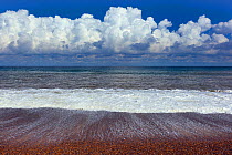 RF- Waves of the North Sea washing onto Weybourne beach, Norfolk, UK. August 2014. (This image may be licensed either as rights managed or royalty free.)