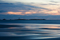 Longships Lighthouse at dusk, near Sennen, Cornwall, UK, September.