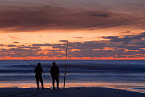 Fishermen at twilight, Sennen Cove, Cornwall, UK, September.