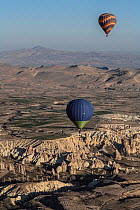 Hot air balloons near Uchisar city, Cappadocia, Turkey, March 2006.
