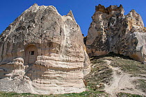 Cave house in eroded rock formations, Goreme, Cappadocia, Turkey, March 2006.