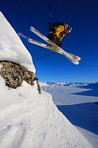 Skier leaping over rocks, Jotunheimen, Norway, April 2005.