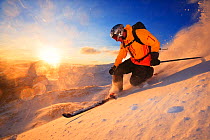 Skier on slope with sunshining in the background, Hemsedal, Norway, January 2006.