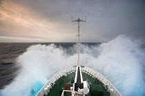 Prow of expedition ship with water splashing around it, Drake Passage, Chile. March 2006.