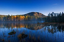 Bukollen mountain reflected in lake, Fla, Hallingdal, Norway, October 2006.