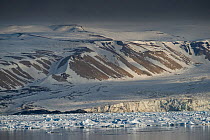 Hinlopen strait, with mountains and ice floe, eastern coast of Svalbard, Norway, June 2014.