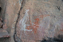 Aboriginal rock art of Kangaroo and hunter, from Kakadu National Park, Northern Territory, Australia. December 2012.