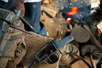 Blacksmith forging handgun, Boje Village, Cross River State, Nigeria.