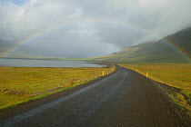 Rainbow over road on the south east coast of Iceland, August 2003.