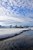 Lamar River in snow, Lamar Valley of Yellowstone National Park, Wyoming, USA. February 2015.