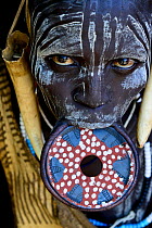 Woman with lip plate, which signifies she is a married woman, Mursi tribe, Mago National Park. Ethiopia, November 2014
