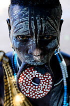 Woman with lip plate, which signifies she is a married woman, Mursi tribe, Mago National Park. Ethiopia, November 2014