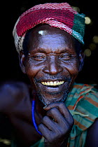 Arbore man smiling, with traditional clothes. Lower Omo Valley. Ethiopia, November 2014