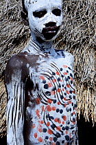 Karo boy with decorative skin painting. Karo tribe, Omo river, Ethiopia, November 2014