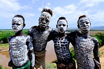 Karo boys with decorative skin painting. Karo tribe, Omo river, Ethiopia, November 2014