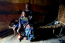 Elderly Borona woman, with her young grandson. Ethiopia, November 2014