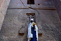 Christian worshiper studying at Bet Medhane Alem (part of the northwestern group of churches in Lalibela). UNESCO World Heritage Site. Lalibela. Ethiopia, December 2014.