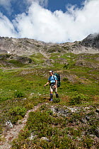 Hiker on the Bailey Range Traverse near Eleven Bull Basin, Olympic National Park, Washington, USA, August 2014.