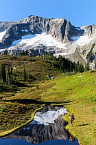 Vicky Spring next to a small tarn, Lyman Lakes Basin, Glacier Peak Wilderness, Wenatchee National Forest, Washington, USA, September 2014. Model released.