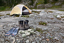 Hiking boots outside a tent, Ferry Basin, Bailey Traverse, Olympic National Park. Washington, USA, August.