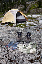 Hiking boots outside a tent, Ferry Basin, Bailey Traverse, Olympic National Park. Washington, USA, August.