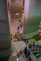 Tourists at G-Cans Project, world's largest underground flood water diversion facility, Kasukabe, Saitama, Greater Tokyo Area, Japan, Asia. March 2014.