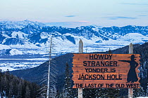 Sign on Teton Pass overlooking Jackson Hole, Wyoming, USA. February 2014.