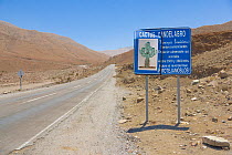 Road sign promoting conservation of the rare Candelabra cactus, (Browningia candelaris) Atacama Desert, Chile.