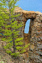 Cape Hoboy cliffs with eroded window, Olkhon island, Lake Baikal, Russia, June 2014.