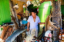 Trader with animal-skins, Pucallpa, Huanuco Region, Peru. September 2013.