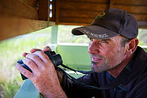 Yves Chesselet inside the bird hide at Rocherpan National Park, Western Cape, South Africa. October 2014.