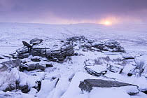 Great Staple Tor covered in snow, at sunrise, Dartmoor National Park, Devon, UK. January 2015.