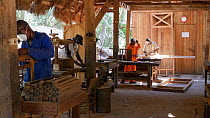 Men working in a workshop in a sustainable timber yard, Mezimbite Sustainable Forest Camp, Mozambique, 2014.