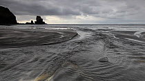 Tidal channel flowing into Talisker Bay, Isle of Skye, Inner Hebrides, Scotland, UK, October 2012.