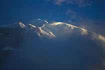 Mount Gyala Peri covered in snow, Yarlung Zangbo Grand Canyon National Park, Nyingchi Prefecture, Tibet, China.