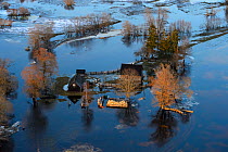 Aerial view of houses flooded by  spring melt,  Soomaa National Park. Parnumaa county, Estonia, April 2013.