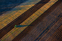 Aerial view of a tractor ploughing,  Vooremaa Landscape Reserve, Tartumaa, Estonia, October 2013.