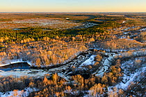 Aerial view of ice breaking in Halliste river, with Kuresoo bog in the background.  Soomaa National Park, Viljandimaa County. Estonia, April 2013.