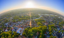 Aerial fish-eye view Tartu Old Town with Raatuse street coloured golden by the rising sun. Tartumaa, Estonia. May 2013.