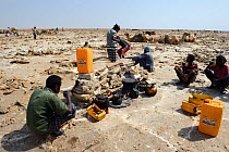 Salt mining at the Lake Assale, the workers are having a break with coffee. Danakil depression, Afar region, Ethiopia, March 2015.