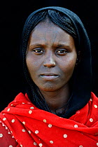 Head portrait of Afar tribe woman with facial tattoos / skin scarifications and wearing a head scarf, Malab-Dei village, Danakil depression, Afar region, Ethiopia, March 2015.