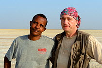 Photographer Eric Baccega with his guide in the desert, Danakil depression, Afar region, Ethiopia, March 2015.