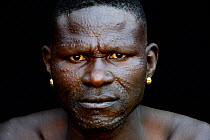 Toposa tribe man with elaborate facial skin scarifications, Omo Valley, Ethiopia, March 2015.
