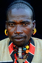 Hamer tribe man wearing traditional jewels, Omo Valley, Ethiopia, March 2015.