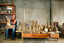 Cuban pottery craftsman in his workshop, Trinidad City, Sancti Spiritus Province, Cuba, Caribbean, July 2008.