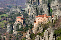 Two Greek Orthodox rock Monasteries  in Meteora. The Holy Monastery of Rousanou/St. Barbara (foreground right, founded in the middle of 16th century) and in the background the Holy Monastery of St. Ni...